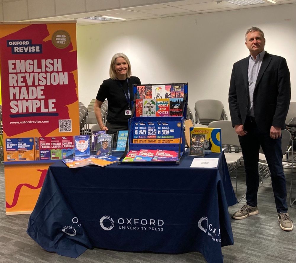 OUP team members on the stand at LitDrive National Conference, with a display of resources including Oxford Revise English Language and English Literature revision guides, plus Rollercoasters for KS3 reading.