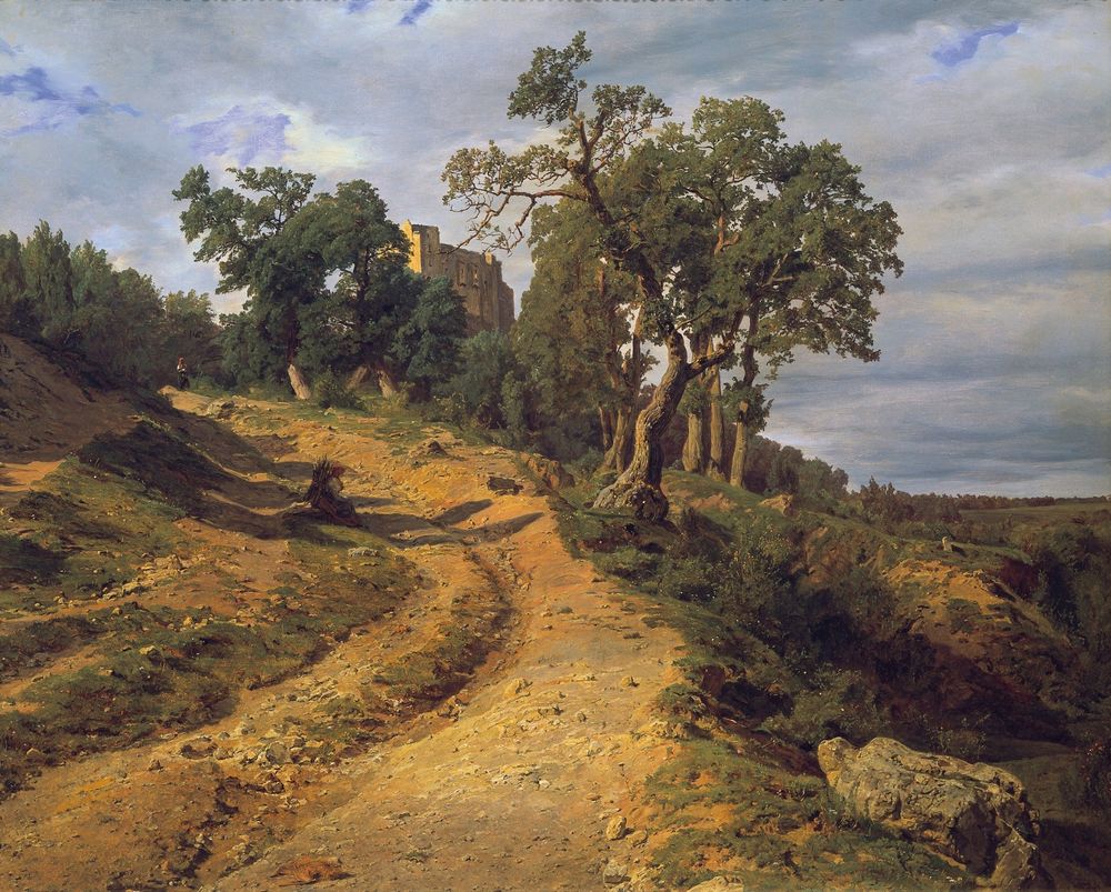 a dirt road with trees and a building in the background