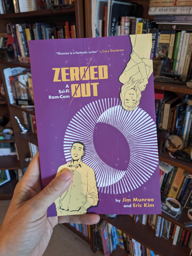 A purple covered graphic novel named Zeroed Out by Jim Munroe and Eric Kim