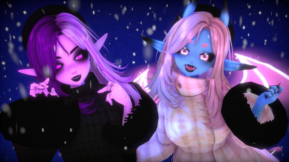 A waist up image of Purple and Glow in winter coats. Purple is in an all black fur trimmed coat, while Glow is in a pink plaid coat with black fur trim. They both are wearing black berets and have the same layered shoulder length hair. Snow surrounds them and the background is dark blue. They are both smiling at the camera with their hands up to their faces. 