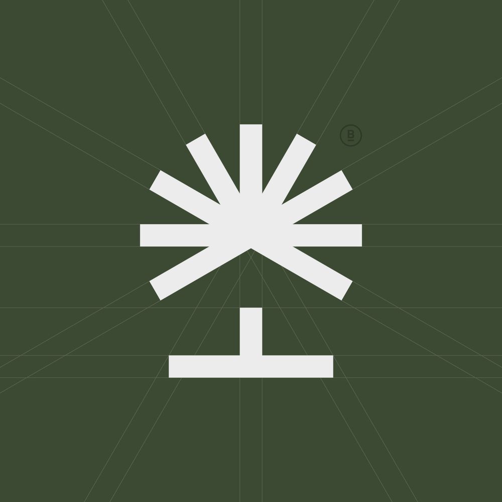 A modern logo that combines tree branches and a negative space house in a minimalist style.