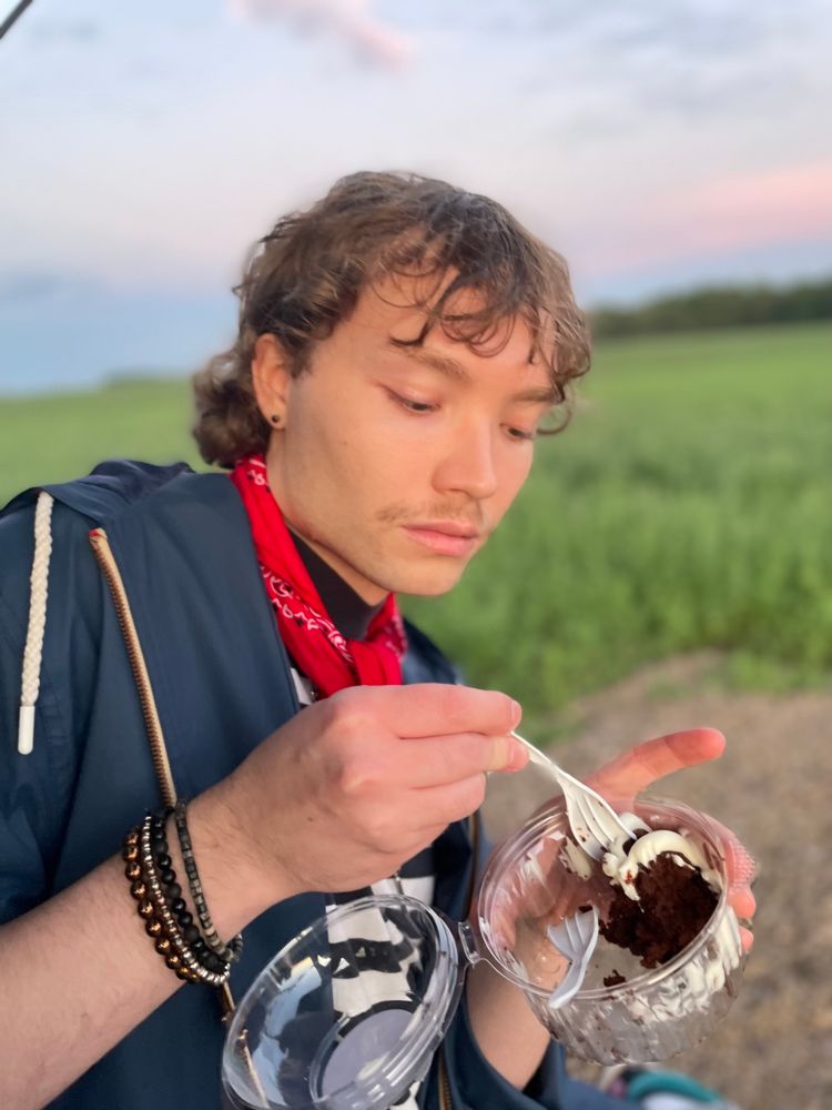 photo of me in a sunset cornfield. i have cake