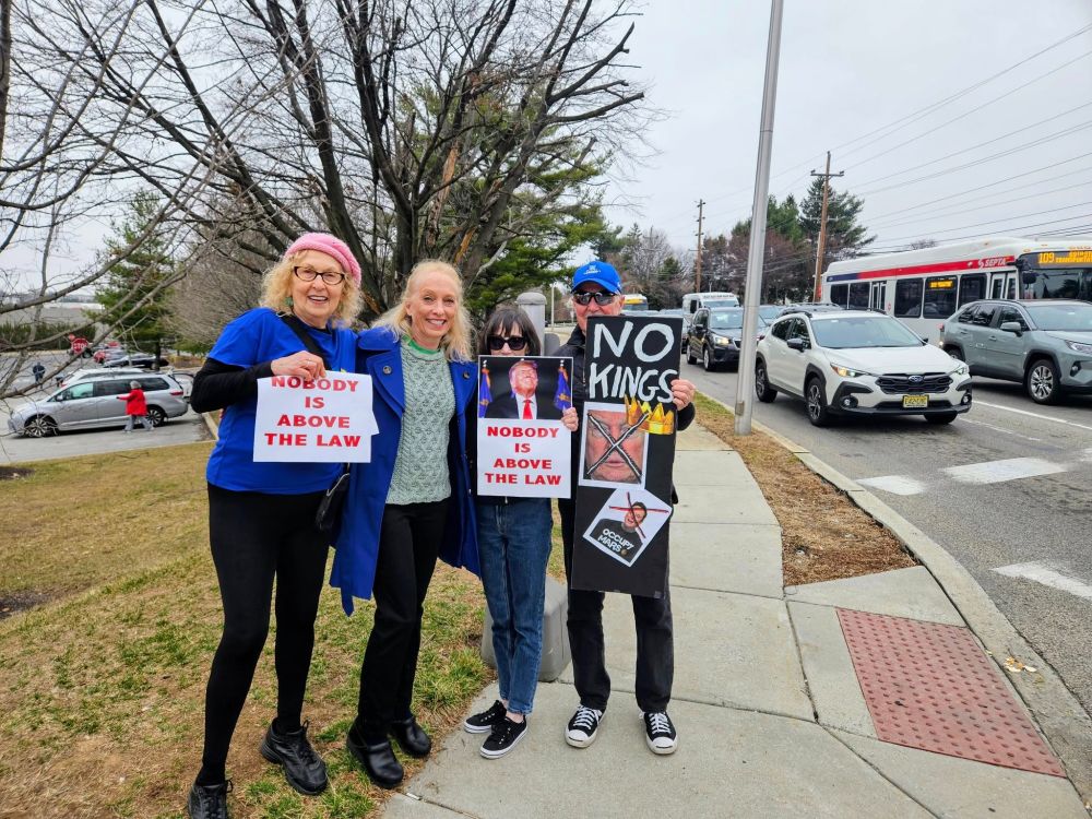 Congresswoman Mary Gay Scanlon smiling with three "No Kings" protesters, Springfield PA, March 15, 2025.