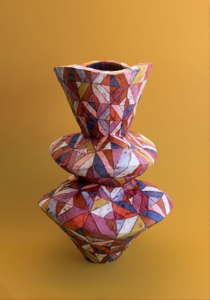 Vase with quilt like pattern embellishments 