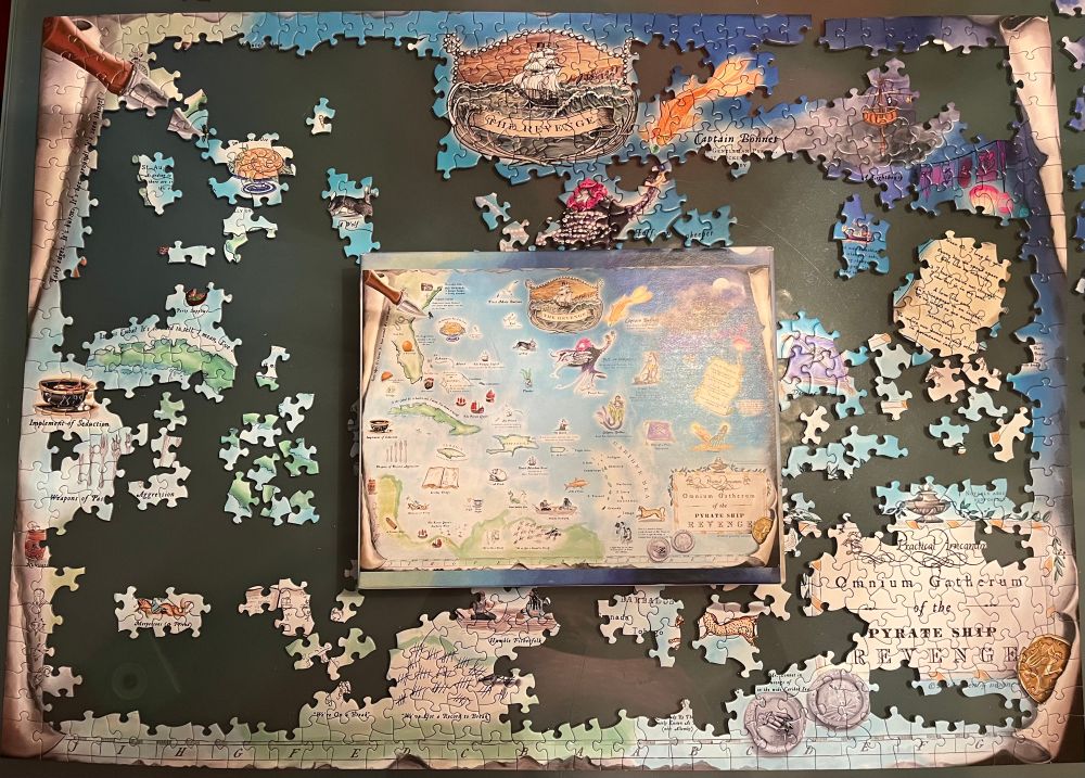 Day 5 progress showing puzzle pieces of “A map of the Caribbean charting the adventures of the Pyrate Ship Revenge.”