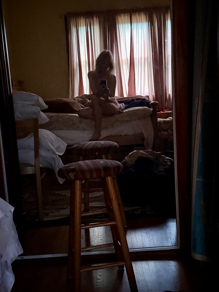 Selfie reflection in the early morning light at a friend's place. 