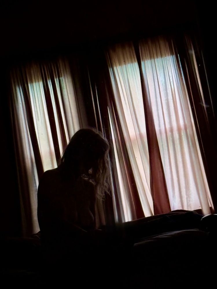 Selfie reflection in the early morning light at a friend's place.