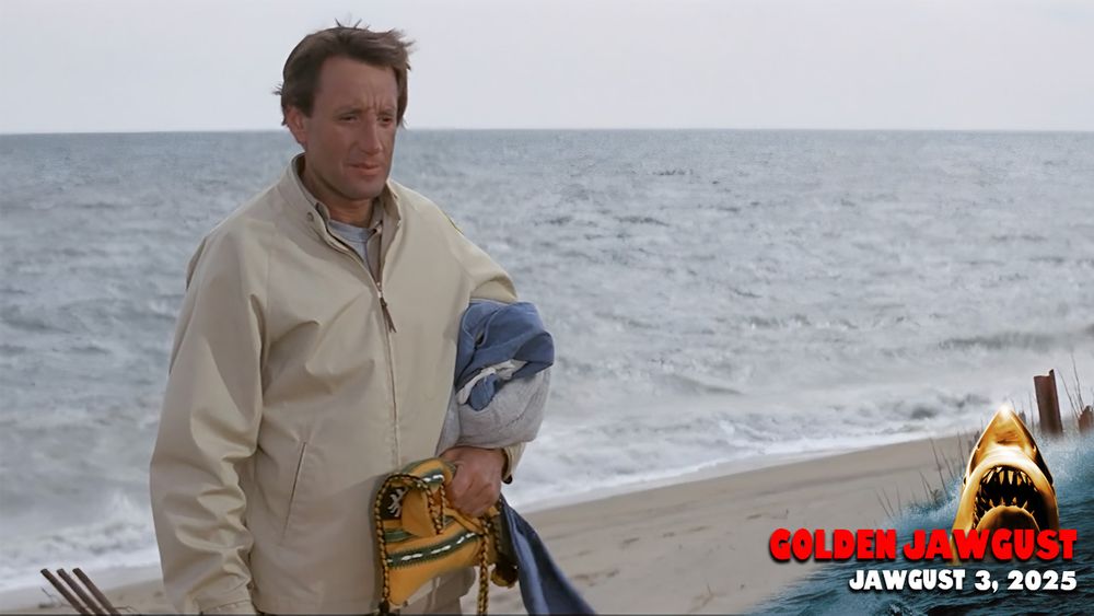 Roy Scheider as Martin Brody standing on the beach holding the personal items of Chrissy Watkins, who he's pretty sure he is seeing the remains of on the beaches of Amity Island. Probably just a boat accident.