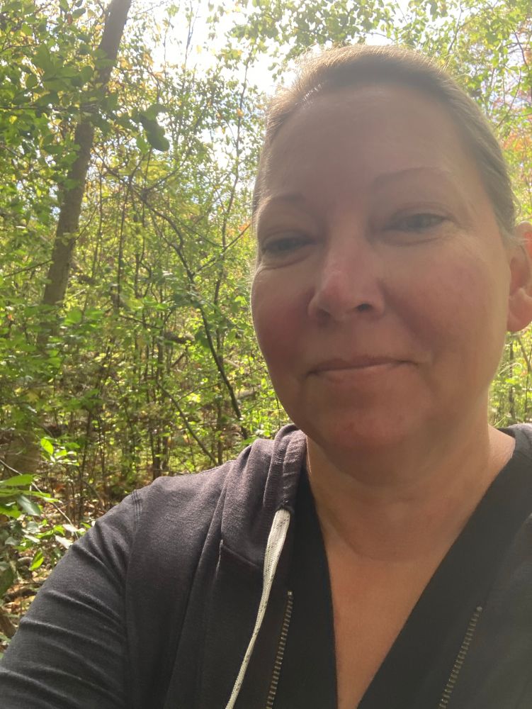 Selfie of Jennifer in the woods 