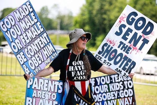 Member of the Christian faith celebrating a mass shooting