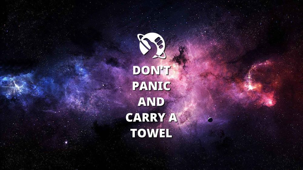 In front of a beautiful red and blue nebula is written: Don't panic and carry a towel.