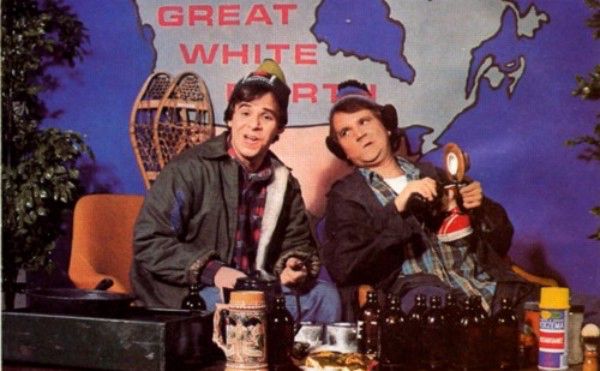 Canadian National Treasures Doug and Bob McKenzie on the set of the popular Great White North talk show, dressed in their finest holiday clothes, singing their classic take on 12 Days of Christmas. They are wearing toques, because Doug and Bob McKenzie. Hose off, you hoser. 