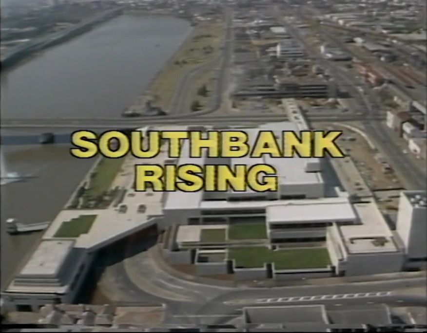 Aerial view of the Southbank precinct circa 1990s with the superimposed text SOUTHBANK RISING 