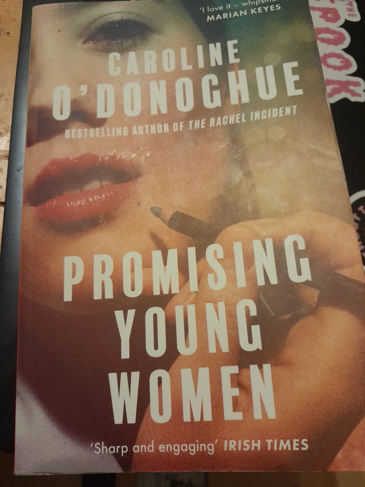 Cover of "Promising Young Women" by Caroline O'Donoghue. Cover is of a woman applying make up