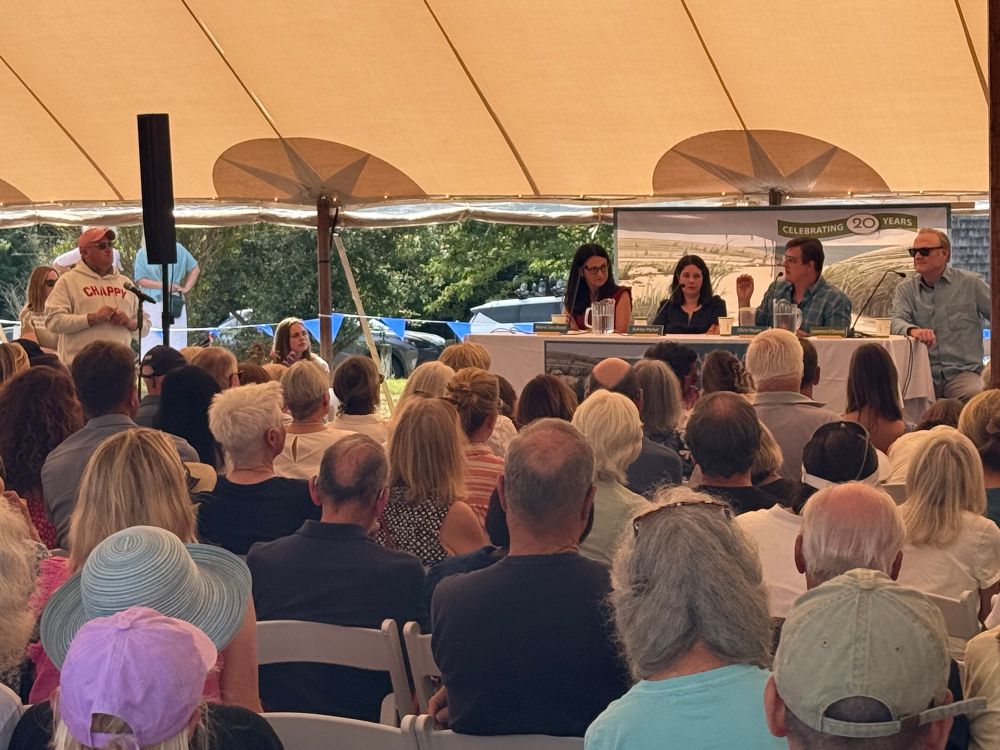 A man asks the "The Press Under Pressure: Media's Role in a Shifting Democracy" panel a question.