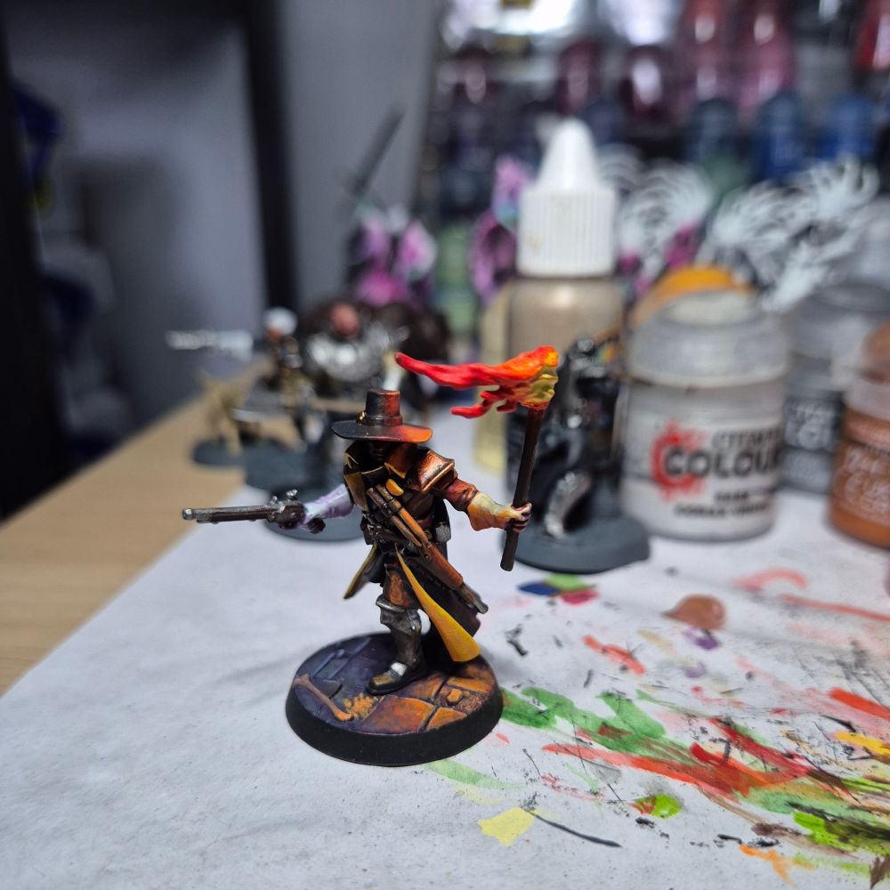 Work in progress on a mini from Warhammer Underworlds Hexbane's Hunters warband with painstaking object sourced lighting from the torch the witch hunter is carrying casting light on him and the base.