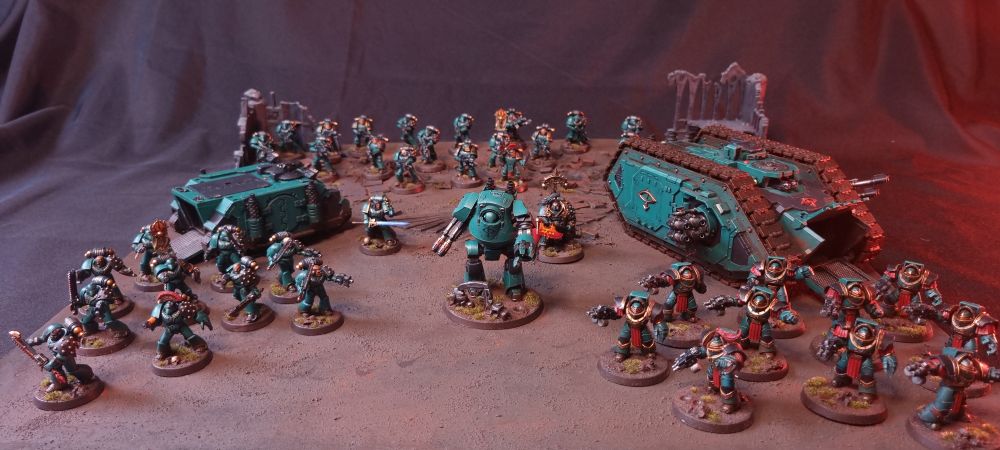 A Sons of Horus army on a simple battle mat.