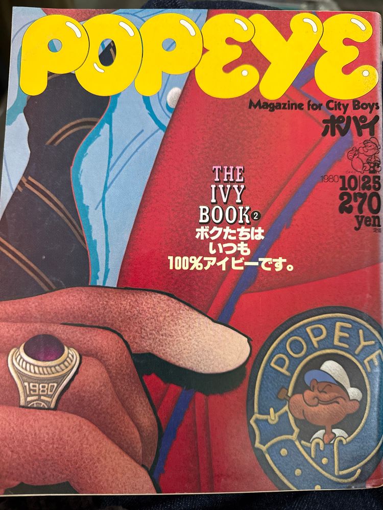 Cover of Popeye Magazine #89, October 1980. Illustration is of a chest and hand of a person in a blue OCBD, rep tie, red blazer with Popeye patch and a generic class ring.
