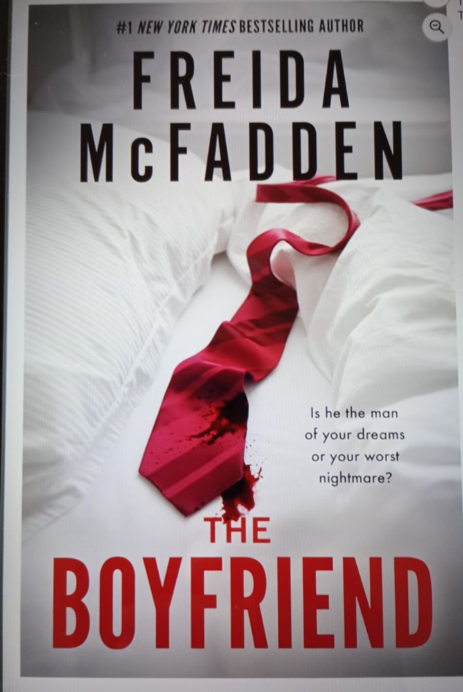 Book cover showing a red tie on a white bed. The Boyfriend by Frieda McFadden