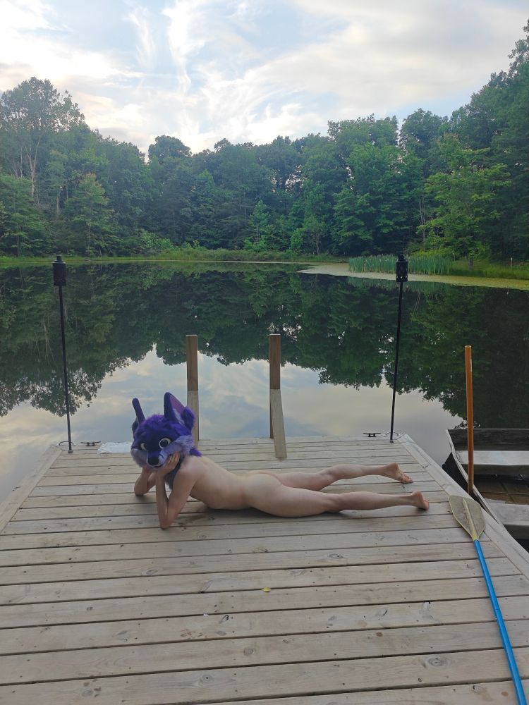 Niqnaq posing on a lake dock, nude
