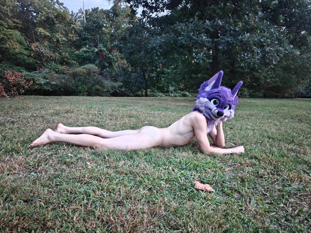 Laying in the grass, nude