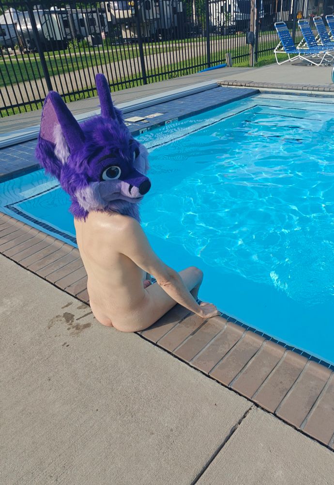 At the pool, feet in the water