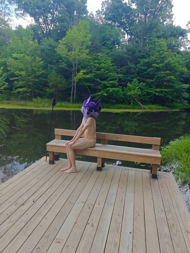Sitting on a bench outside, nude 