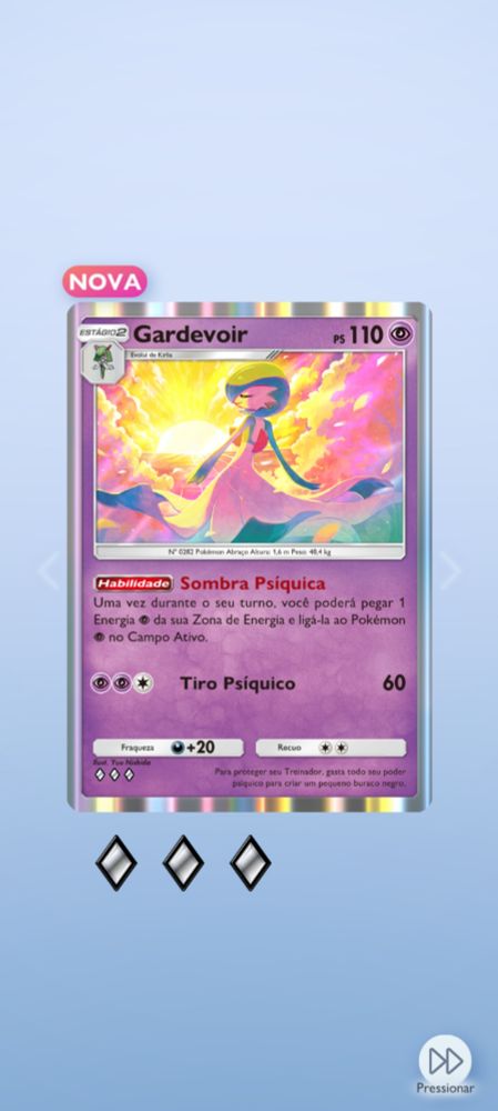 Carta do Pokémon Trading Card Game, com pokémon Gardevoir posando para um fundo de pôr do sol, com a descrição das habilidades da carta abaixo.