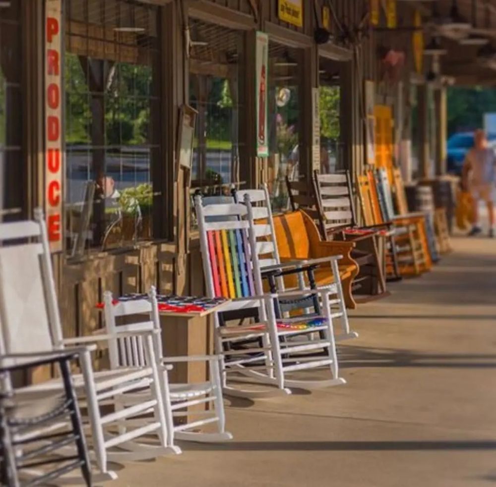 Rainbow rocking chair on the porch at Cracker Barrel. Angry MAGA not pictured (though delightfully imagined by this author). 