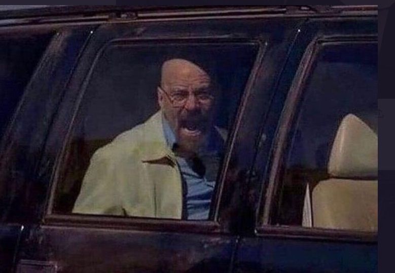 Walter White from Breaking Bad trying to yell from inside a car