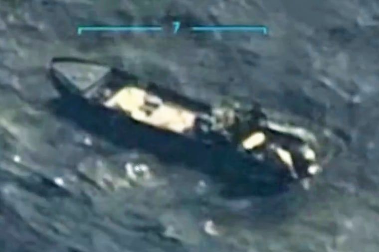 Grainy image of a boat in the sea with several people on board and an outboard motor -- there is no way in hell this boat would make it from Venezuela to Miami. 