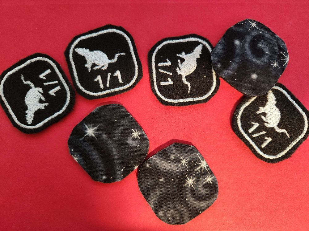 A set of handmade, embroidered creature tokens for magic the gathering. These feature 1/1 rats.