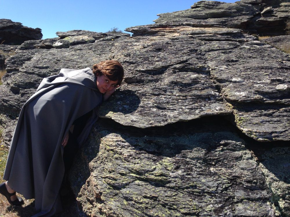 Myself dressed as a hobbit leaning over the same rock as Aragorn, in Poolburn, New Zealand. 