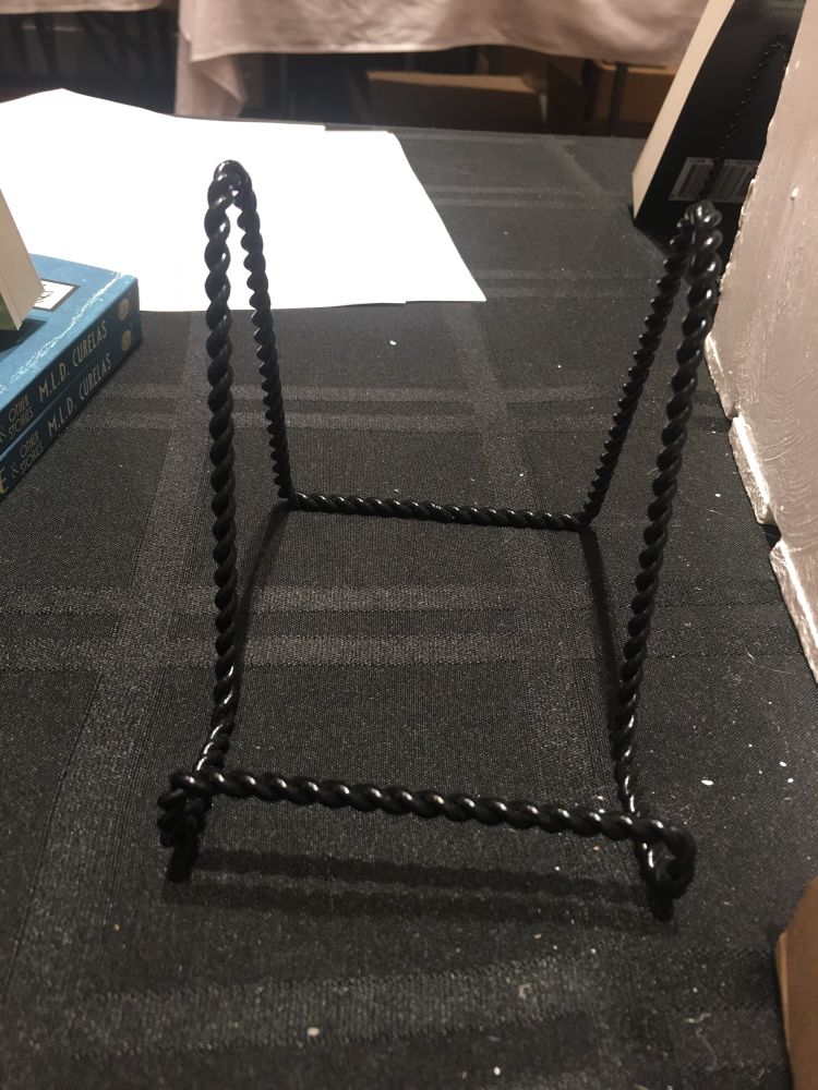Empty book stand in a table. It used to have copies of Starship Librarians.