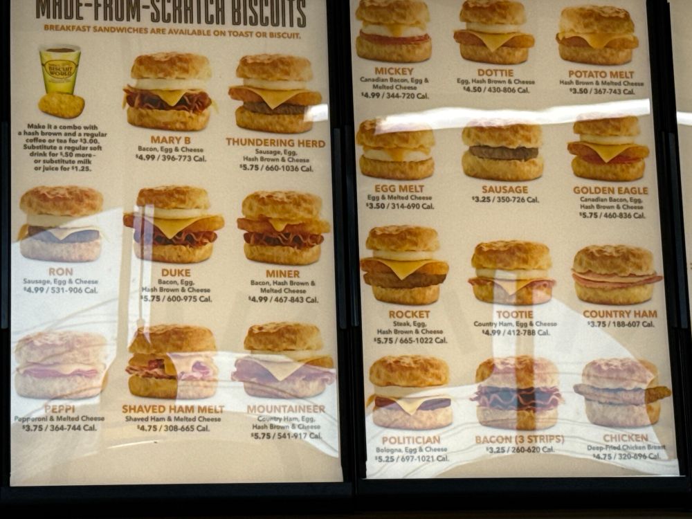 The biscuit menu at Tudor’s Biscuit world. Many permutations of eggs/bacon/sausage/potato/cheese/Canadien bacon abound. I’m partial to the miner, which now only the alt text readers will know. It’s our secret. SHHHHH. Don’t tell commish.  