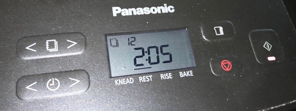 A photo showing the setting for the Panasonic bread machine. It's on basic dough setting, number twelve, with two hours and five minutes left on this particular programme. 
