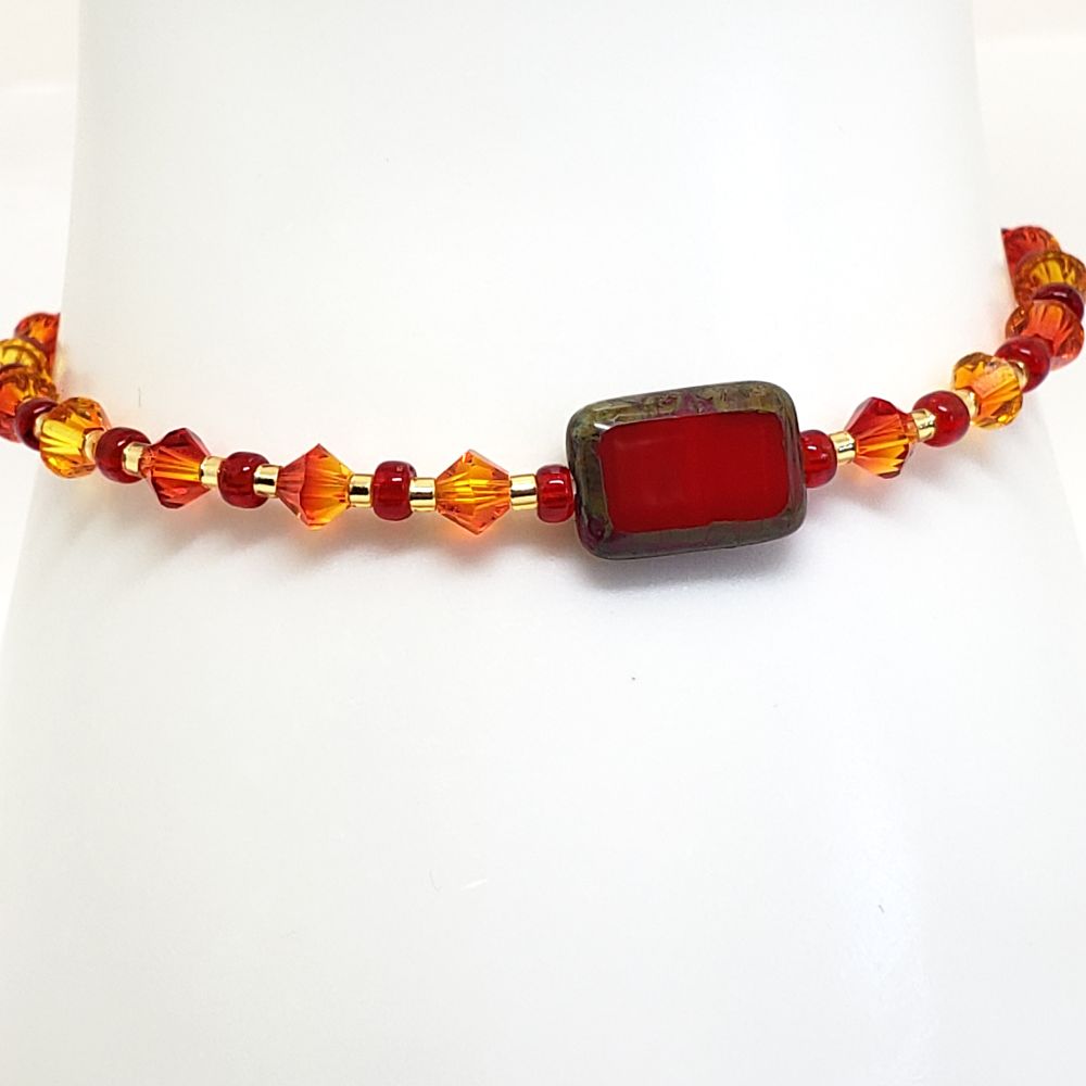 Size 6.75" stretch bracelet Inspired by the BTS song, FIRE. Includes Genuine 4mm Fire Opal Bicone Swarovski Crystal beads; Main bead is a Vintage red Czech glass bead with an effect around the edges. Japanese Seed Beads: 8/0 Miyuki Transparent and 11/0 Delica Galavanized Gold. Finished with a gold filled crimp bead to hide and protect the knot. My bracelets are all hand-made and I am an ARMY.