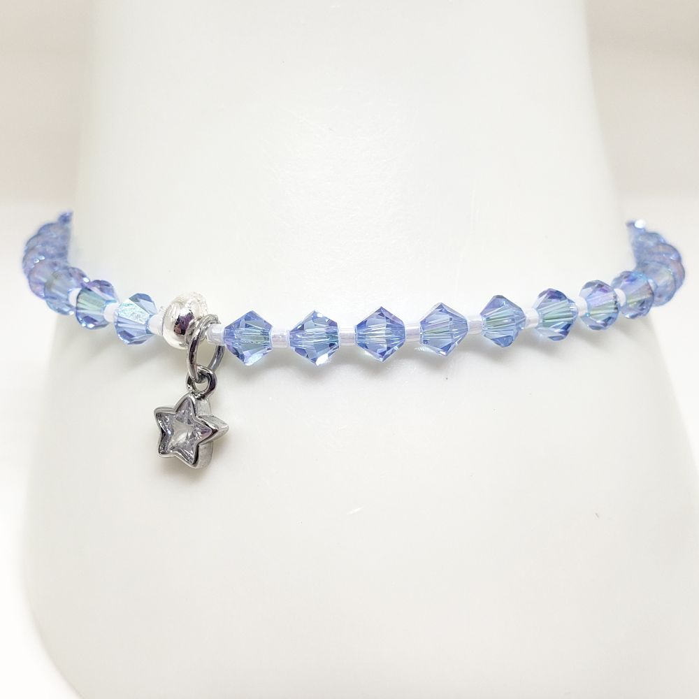 Size 7.0" BTS Jin Tour and Blue Mic inspired bracelet. Includes Genuine Swarovski Crystal beads: 4mm biceon beads in Light Sapphire Shimmer. Japanese seed beads are opaque luster white. The charm is a sterling silver and cubic zirconia star charm. Crimp bead is sterling silver and hides/protects the knot. My bracelets are all hand-made and I am an ARMY.