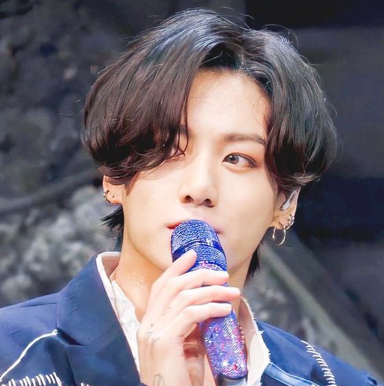 Jungkook with his multicolored purple microphone