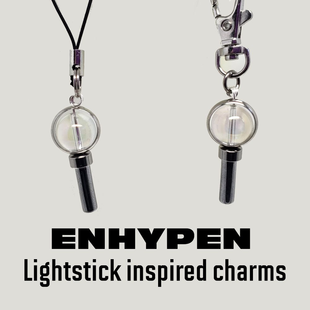 ENHYPEN ENGENE BONG lightstick Charm with lanyard cell phone connector OR Swivel Clasp. Main bead is 10mm Rainbow Crystal Natural Quartz Gemstone Bead. Lightstick handle is a 6mm x 16mm silver plated onyx tube bead and a 3mm x 6mm stainless steel cylinder bead. Bead frame is 11mm rhodium. Choose Lanyard OR Swivel Clasp. The Lanyard is black polyester with a stainless steel split ring connector. The clasp is imitation rhodium-finished steel and pewter (zinc-based alloy), 17x9mm with swivel. The charm by itself is 11mm wide and 33mm long.