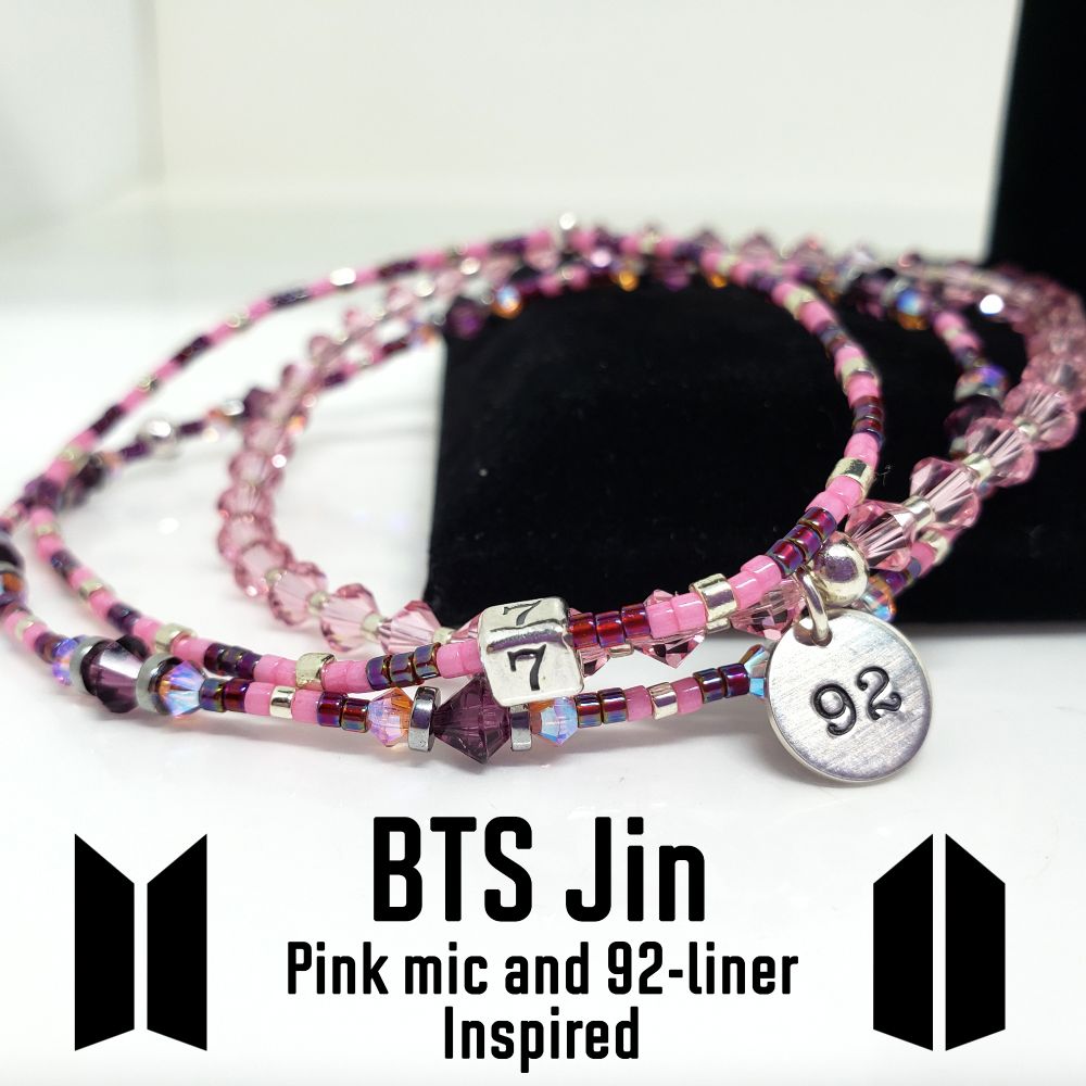 Size 7.25" BTS Jin / Seokjin Pink Microphone, 92-liner and 7 Inspired Bracelet Set. Includes 4mm Genuine Bicone Swarovski Crystals in Light Rose and Amethyst, 3mm Genuine Bicone Swarovski Crystals in Light Rose AB2X (aurora borealis), hematite spacer beads, seed beads in galvanized silver, opaque carnation pink-dyed white, and opaque silver-lined rainbow dark cranberry. Main bracelet includes a custom Sterling Silver 92 charm for his birthyear and seed bead bracelet includes a sterling silver 7 bead. Jumprings and crimp beads are also sterling silver. Crimp beads hide/protect the knots. My bracelets are all hand-made and I am an ARMY.