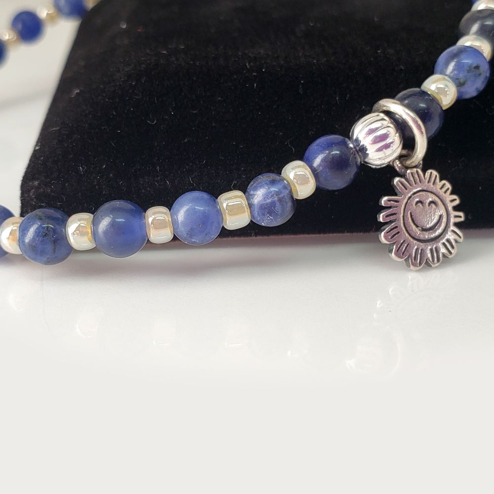 Size 7.25" BTS Jhope Sweet Dreams inspired Bracelet set. Includes 4mm round Dark Blue Sodalite Gemstone Beads and 8/0 Miyuki opaque dyed luster light daffodil seed beads. The charm is a .925 Sterling Silver Smiling Sun charm. Finished with a sterling silver crimp bead to hide and protect the knot. My bracelets are all hand-made and I am an ARMY.
