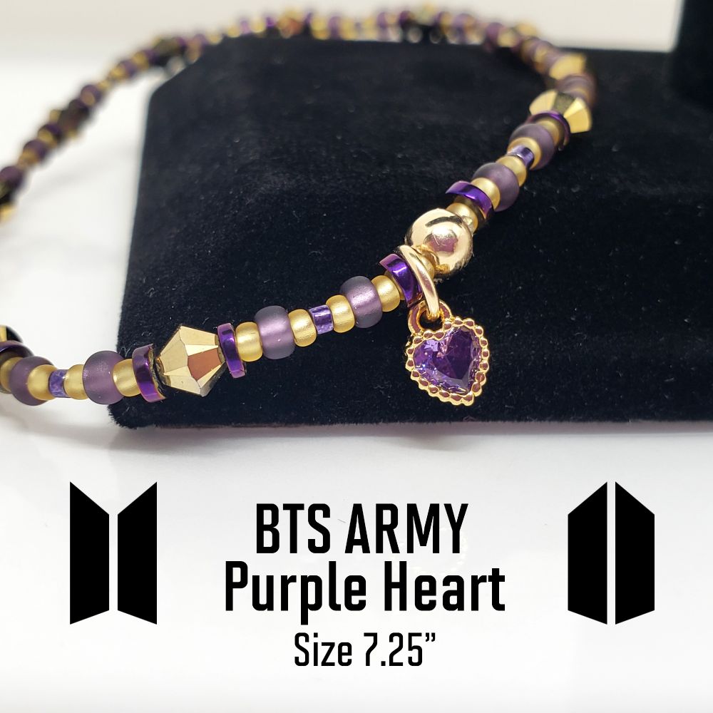 Size 7.25" BTS and ARMY inspired bracelet Includes Genuine 4mm Swarovski Bicone beads in Crystal Aurum AB2X, Hematite purple plated rondelle beads, Japanese seed beads: 8/0 Miyuki Matte Silverlined Ameythyst, 11/0 Semi Matte Silverlined Gold and 11/0 opaque nickle plated eggplant. The charm is gold plated brass with a purple cubic zirconia stone. Finished with a gold filled crimp bead to hide and protect the knot. My bracelets are all hand-made and I am an ARMY.