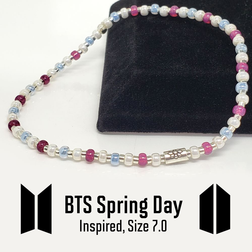Size 7.0" stretch bracelet inspired by BTS song, Spring Day on the You Never Walk Alone album. Made with Japanese Seed Beads: 8/0 Miyuki White Pearl Ceylon, Miyuki Sky Blue Ceylon and Duracoat Silverlined Dyed Peony Pink and 11/0 Delica Galvanized Silver. Also includes a Sterling silver 3x5mm Flower Tube Bead. The knot is hidden under a sterling silver crimp bead. My bracelets are all hand-made and I am an ARMY. Be sure to tell me your bias so I can include a special surprise!