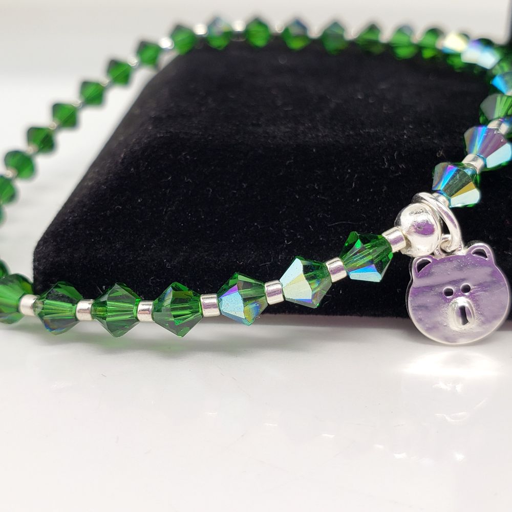 Size 6.5" BTS V / Taehyung Green Microphone and Bear Inspired Bracelet. Includes 4mm Genuine Bicone Swarovski Crystals in Dark Moss AB (Aurora Borealis affect), galvanized silver seed beads and a Sterling Silver bear charm. Jumpring and crimp bead is also sterling silver. Crimp bead hides/protects the knot. My bracelets are all hand-made and I am an ARMY.