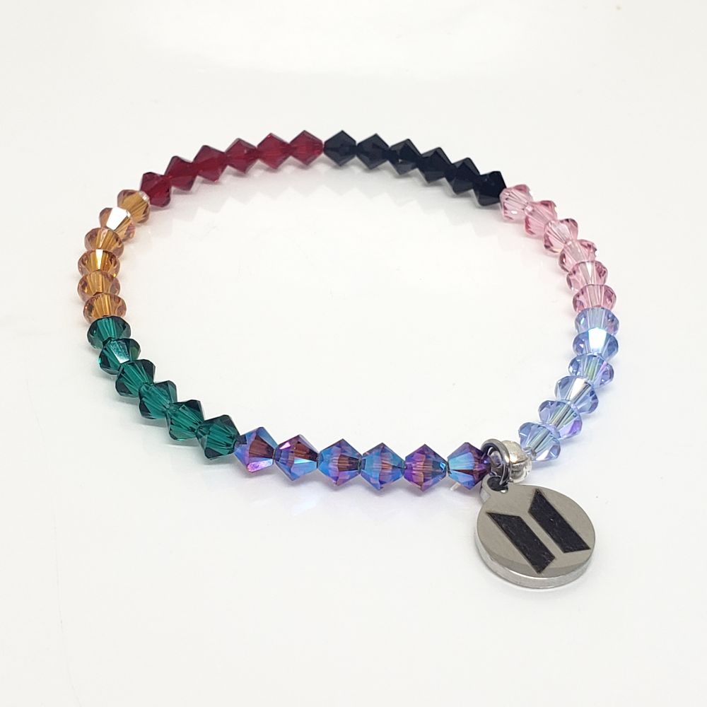 Size 6.0" OT7 Bracelet with BTS Microphone colors in fanchant order. Made for the Love Yourself Speak Yourself, Map of the Soul, BE and Dynamite era microphone colors, this stretch bracelet represents BTS Members' microphone colors and includes 6 each 4mm Genuine Bicone Swarovski Crystal beads for a total of 42 Swarovski beads. The charm is stainless steel with BTS logo on one side and ARMY logo on the other side. Crimp bead is sterling silver and hides/protects the knot. My bracelets are all hand-made and I am an ARMY.