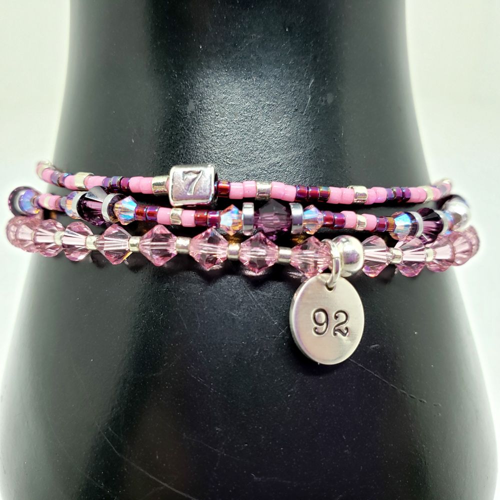 Size 7.25" BTS Jin / Seokjin Pink Microphone, 92-liner and 7 Inspired Bracelet Set. Includes 4mm Genuine Bicone Swarovski Crystals in Light Rose and Amethyst, 3mm Genuine Bicone Swarovski Crystals in Light Rose AB2X (aurora borealis), hematite spacer beads, seed beads in galvanized silver, opaque carnation pink-dyed white, and opaque silver-lined rainbow dark cranberry. Main bracelet includes a custom Sterling Silver 92 charm for his birthyear and seed bead bracelet includes a sterling silver 7 bead. Jumprings and crimp beads are also sterling silver. Crimp beads hide/protect the knots. My bracelets are all hand-made and I am an ARMY.