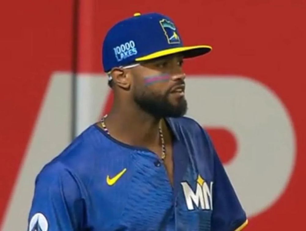 Willi Castro wearing eyeblack in the trans pride colors