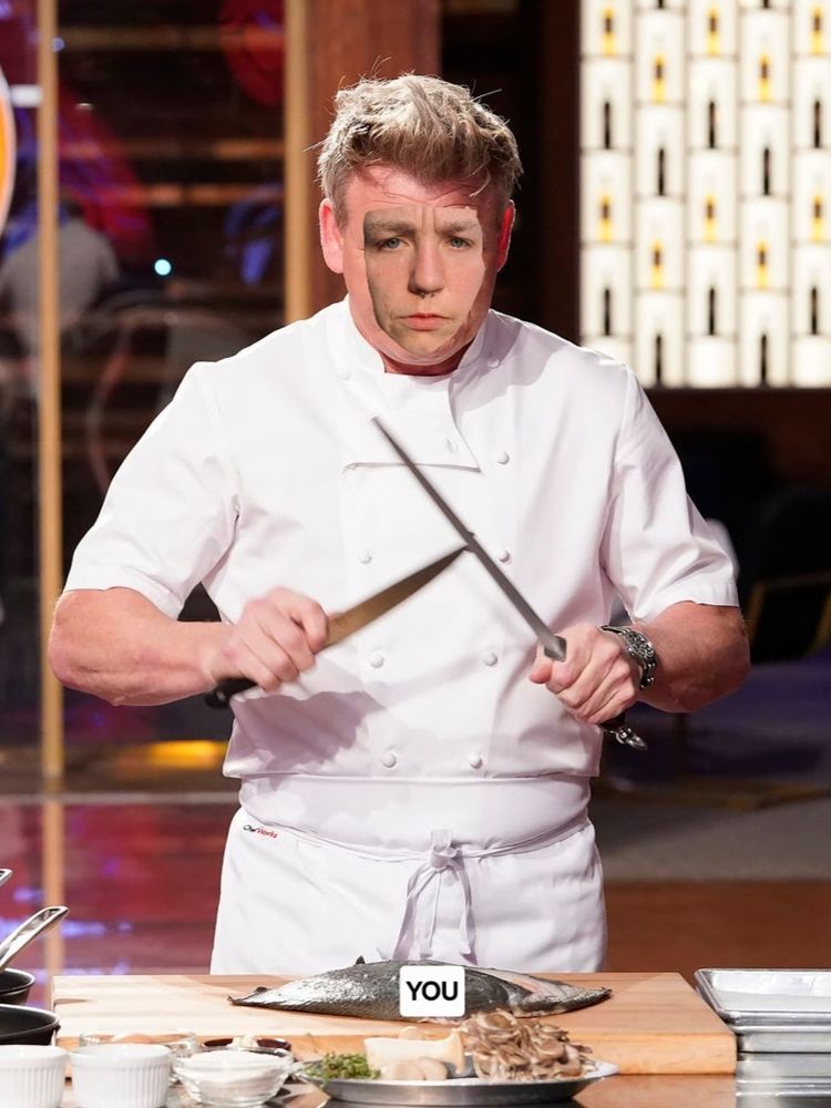 Molomoots face poorly photoshopped over a picture of ramsay prepping a fish. The fish has the word "you" written over the top
