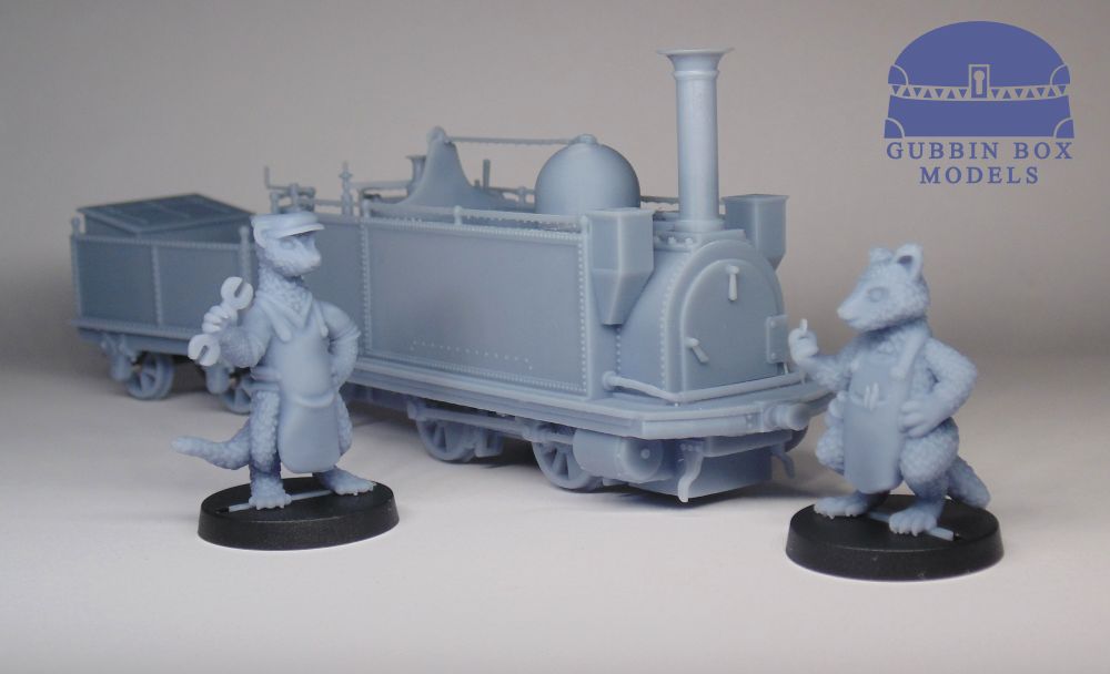 Two miniatures, Randell and Noodles, posing in front of a steam locomotive. All of them are resin printed kits that we make.